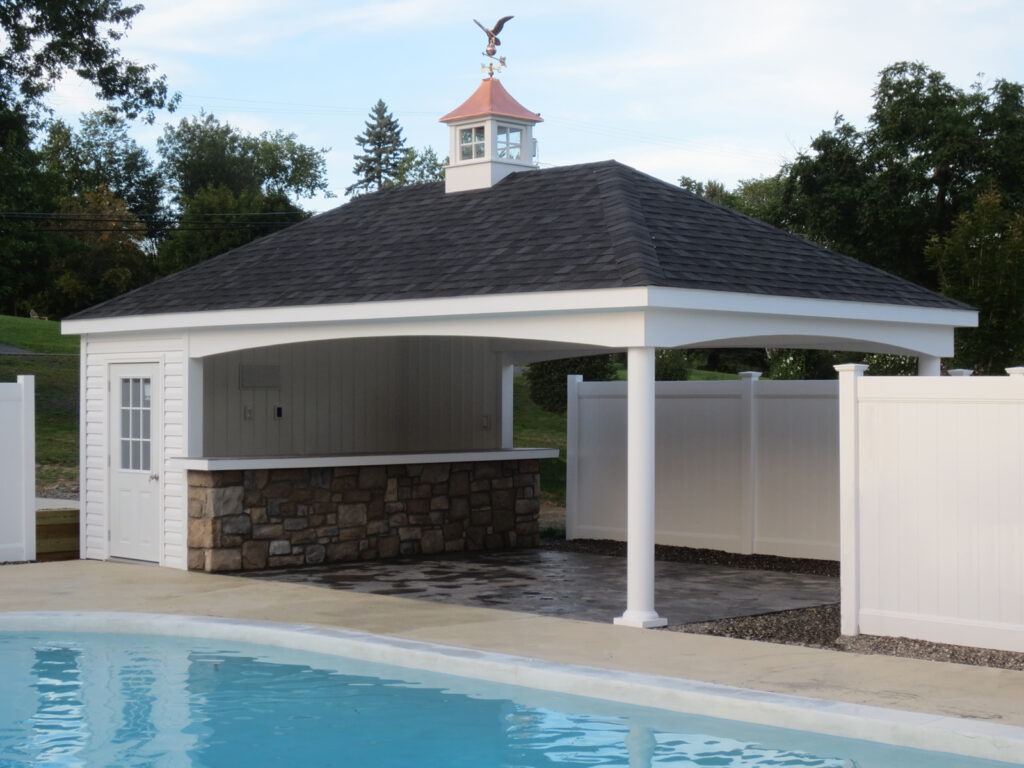 pool shed with extended roof for patio