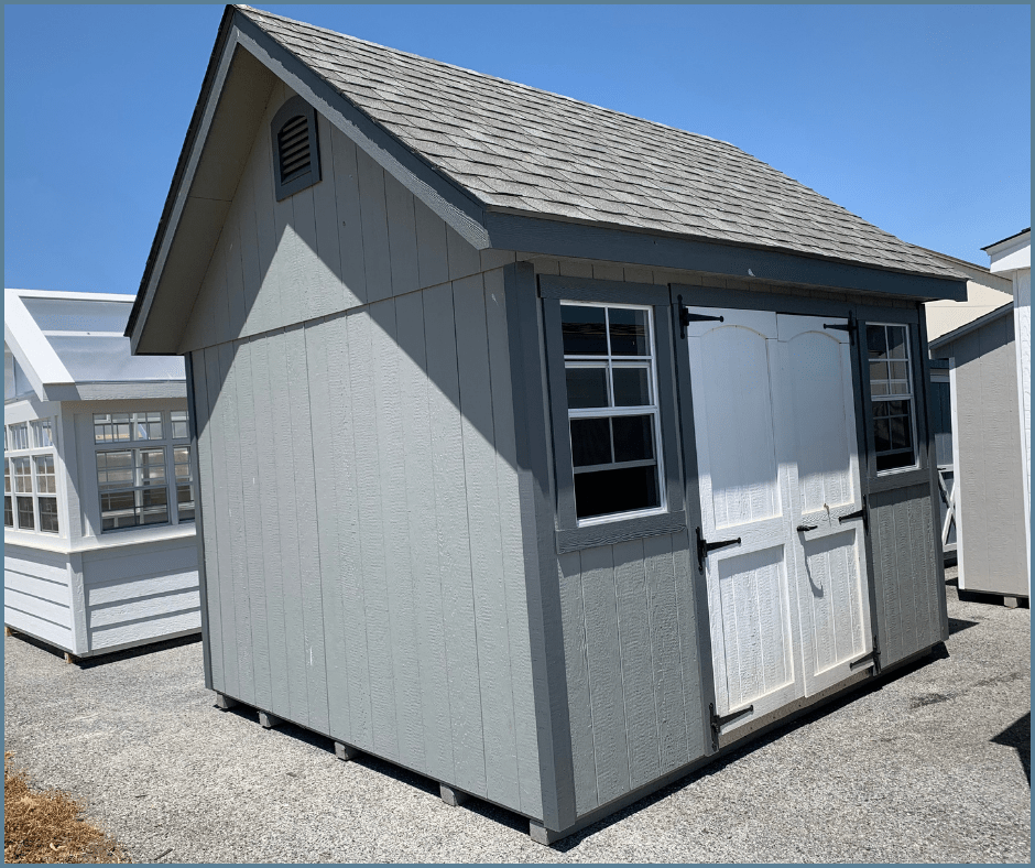 manor shed asphalt shingles windows white doors